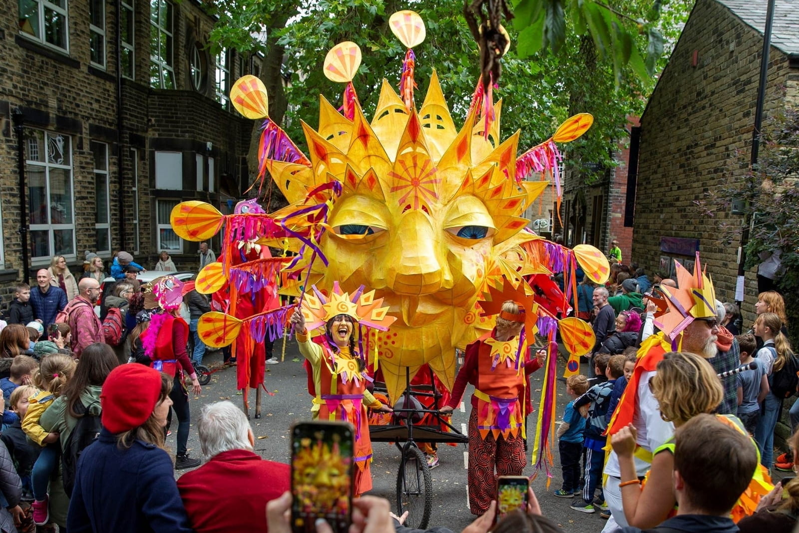 Handmade Productions - daytime parade with sun